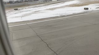 Takeoff from Chicago airport over snow