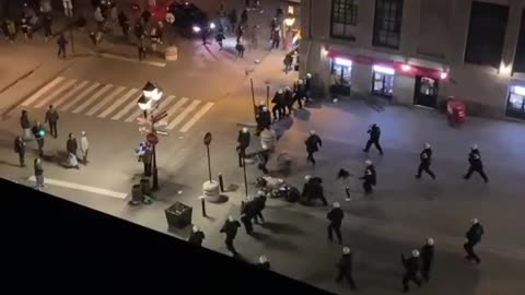 Video Shows A Woman Being Pushed To The Ground By SWAT At Last Week's Anti-Curfew Protest
