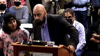 Father brings his son to school board meeting to speak against Antifa teacher