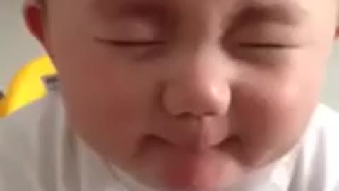 cute baby eating lemon at the first time