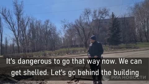 Ukraine. Faces Of War. A resident of Rubezhnoe is trying to evacuate his mother