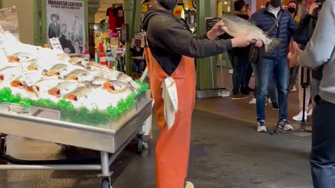 Employees Toss Fish at Seattle Fish Market
