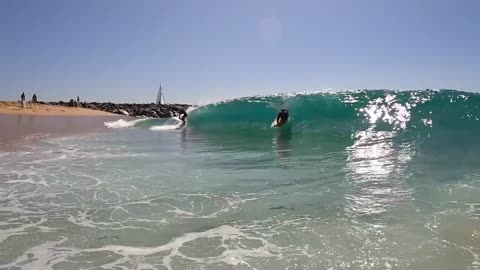 Surfing and Skimboarding WEDGE on massive HIGH TIDE