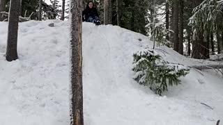 Sledder Takes a Spill into Snow