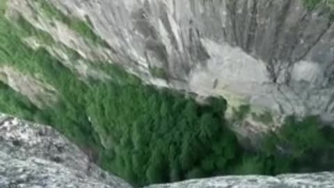 Extreme bungee jumping session off of insane cliff