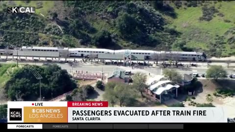 Metrolink train forced to evacuate after catching fire in Santa Clarita, California.