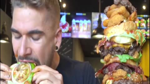 Title: "Epic Burger Challenge: Conquering the Monstrous Mega Burger!"