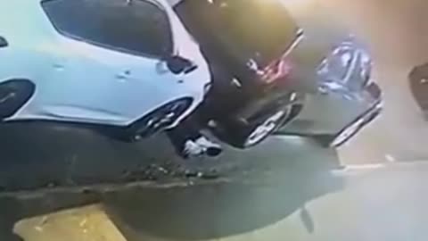 Male flung belt around neck of female, dragged her btween vehicles, and sexually assaults her