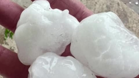 hail stones the size of golf balls falling down during a thunder storm in Yukon, Oklahoma.