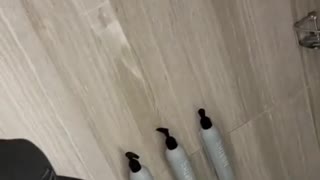 Guys Investigate Water Spouting Wand In Hotel Room