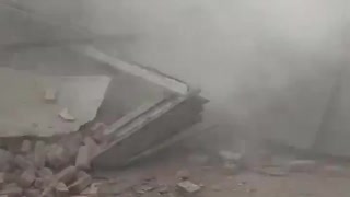 Witness nearly crushed to death by collapsing building