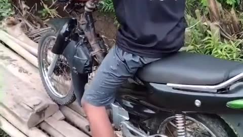 the moment the motorcyclist fell off the bridge