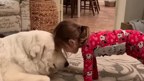 Little Girl Sweetly Bonds With Adorable Pup