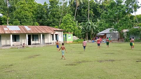 Little boys playing football