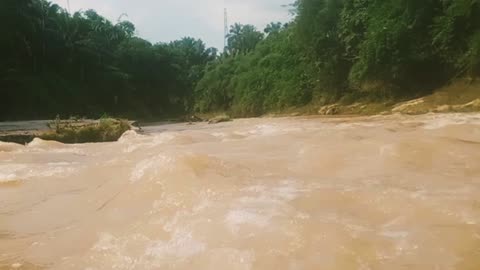the sound of rushing currents in the river.