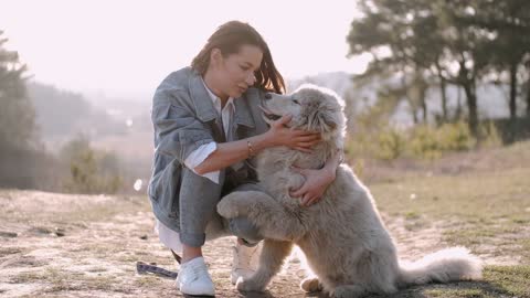 A girl talking to her dog