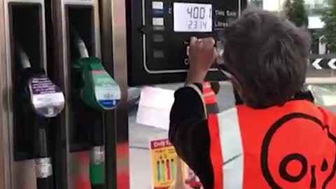 Just Stop Oil eco-mob blockade central London petrol stations, smashing up petrol pumps.