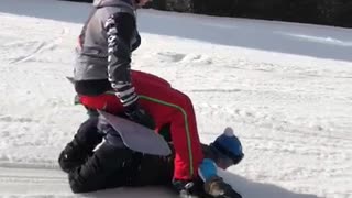 Buddies Show Off a Funky Snowboarding Trick