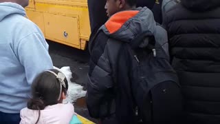 Children Being Held on Bus