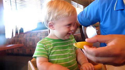 Adorable baby eating lemon for the first ep 1