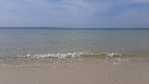 The sea and the sound of the surf on a sunny day