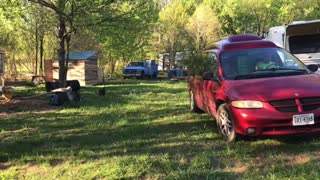 Mini van towing 11,000lb truck out of mud.