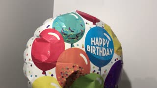 Birthday balloon is turning around.