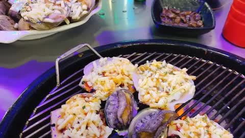 Korean traditional food, grilled clams.