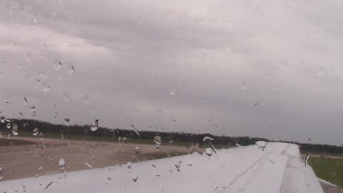 Plane Taking off and landing, aerial view, raining and cloudy, stock footage, creative commons