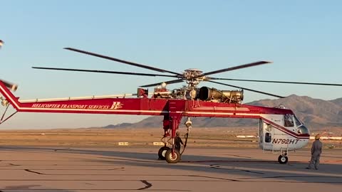 Sikorsky Skycrane with large bucket landing
