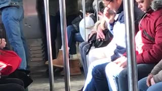 Man dances on subway full of sleepy people