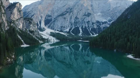 aerial view of lake braies in dolomites mountains water reflections