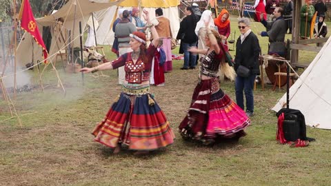 Belly dancers braving the cold weather in traditional costume