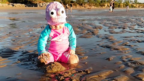 Baby's first time at the beach, like a giant bathtub