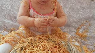 Do you think this baby likes spaghetti?