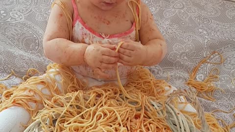 Do you think this baby likes spaghetti?