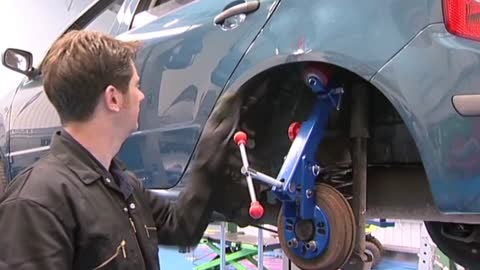How to Roll Guard to Install Larger Tires in a Car