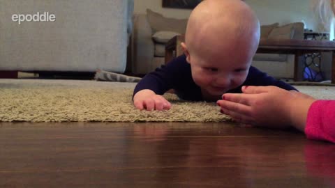 Baby Laughs Hysterically At Rolling Ping Pong Ball