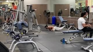 Dude works on his swimming strokes at the gym