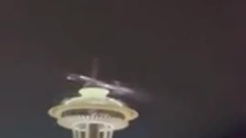 Shiny Rocket Debris Exploding in Night Sky at Seattle