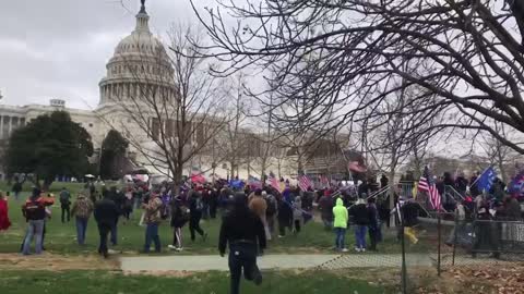 WATCH: Hundreds of Trump supporters storm the barricades at the Capitol building