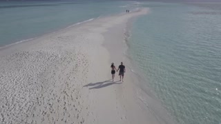 Couple Walking on a Beach