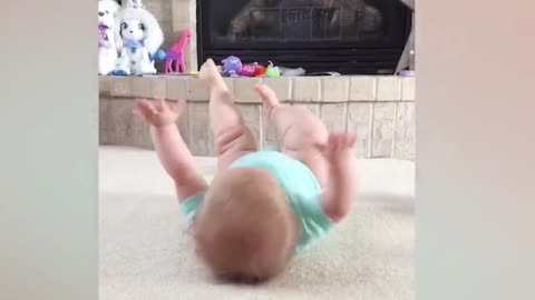 Babies smiling and playing on their own.