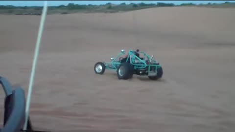 Sandfill driving Roscoe in the Sand Rail and runs over the jumping Plumber's Blaster