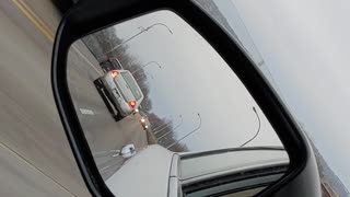 Car Drives in Reverse on Busy Street