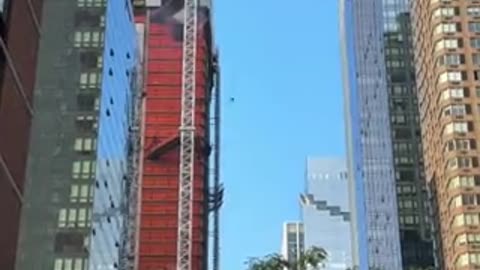 Crane in Manhattan, New York City, caught fire and subsequently collapsed