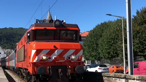 Passenger train Comboios de Portugal Valença-Porto going through Viana do Castelo.