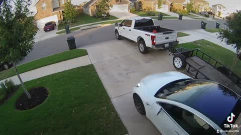 Roommate Moving Tesla Out of Garage Hits Truck