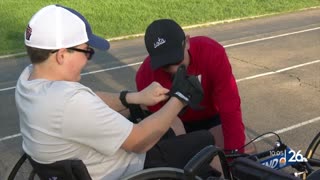 Spina bifida can't stop him from completing a marathon with his dad