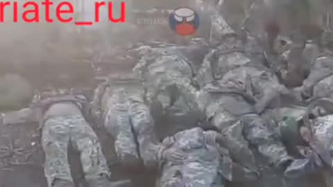 Russian soldiers are collecting the corpses of Ukrainian soldiers